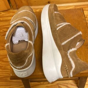 UGG.  Beautiful shoes tan color with white platform